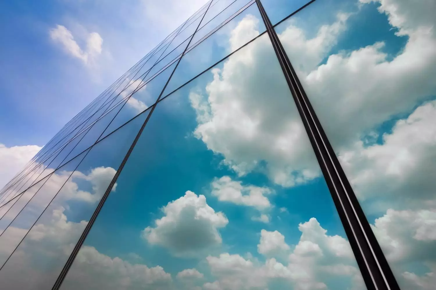 Mirror reflection Reflection of clouds on skyscraper windows.