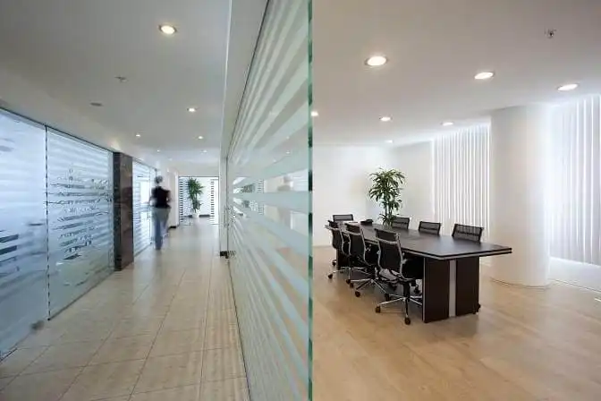 Office conference room with decorative striped window film.